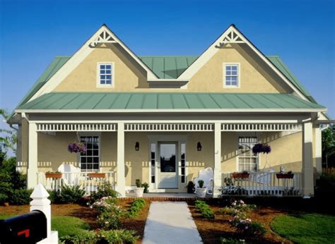 green vinyl house with a green metal roof|green house with metal roof.